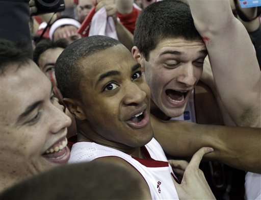 Wisconsin's Jordan Taylor smothered by fans