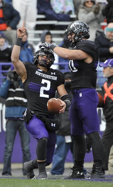 Nov 24, 2011; Evanston, IL, USA; Northwestern Wildcats quarterback Kain Colter (2) celebrates his touchdown with tight end Dan Vitale (40) against the Illinois Fighting Illini during the first half at Ryan Field. Mandatory Credit: David Banks-US PRESSWIRE