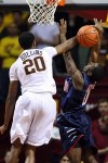 Nov 18, 2012; Minneapolis, MN, USA; Minnesota Golden Gophers guard Austin Hollins (20) blocks Richmond Spiders guard Kendall Anthony (0) during the second half at Williams Arena. The Gophers defeated the Spiders 72-57. Mandatory Credit: Brace Hemmelgarn-US PRESSWIRE