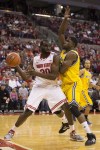 November 23, 2012; Columbus, OH, USA; Ohio State Buckeyes forward Evan Ravenel (30) is pressured out of bounds by UMKC Kangaroos forward/center Fred Chatmon (21) at Value City Arena.