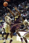 Nov 27, 2012; Tallahassee, FL, USA; Minnesota Golden Gophers guard Andre Hollins (1) passes the ball past Florida State Seminoles guard Michael Snaer (21) during the game at the Donald L. Tucker Center. Mandatory Credit: Melina Vastola-US PRESSWIRE