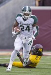 Nov 24, 2012; Minneapolis, MN, USA: Michigan State Spartans running back Le'Veon Bell (24) runs for a first down in the first half against the Minnesota Golden Gophers at TCF Bank Stadium. Mandatory Credit: Jesse Johnson-US PRESSWIRE