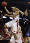 Nov 20, 2012; Madison, WI, USA; Wisconsin Badgers guard Traevon Jackson (left) moves the ball to the basket as Presbyterian Blue Hose guard Austin Anderson(4) defends at the Kohl Center. Wisconsin defeated Presbyterian Blue Hose 88-43. Mandatory Credit: Mary Langenfeld-US PRESSWIRE