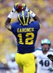 October 20, 2012; Ann Arbor, MI, USA; Michigan Wolverines wide receiver Devin Gardner (12) makes a catch against the Michigan State Spartans during the second half at Michigan Stadium. Michigan won 12-10. Mandatory Credit: Mike Carter-US PRESSWIRE