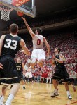 Nov 9, 2012; Bloomington, IN, USA; Indiana Hoosiers forward Will Sheehey (0) goes up for a reverse lay in against Bryant Bulldogs guards Joe O'Shea (33) and Corey Maynard (1) at Assembly Hall. Indiana defeats Bryant 97-54. Mandatory Credit: Brian Spurlock-US PRESSWIRE