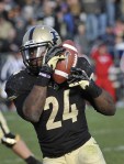 November 24, 2012; West Lafayette, IN, USA; Purdue Boilermakers running back Akeem Shavers (24) catches a pass en route to a 70 yard touchdown run against the Indiana Hoosiers at Ross Ade Stadium.