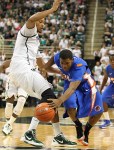 November 20, 2012; East Lansing, MI, USA; Boise State Broncos guard/forward Anthony Drmic (3) drives past Michigan State Spartans center Adreian Payne (5) during the 1st half at Jack Breslin Students Events Center.