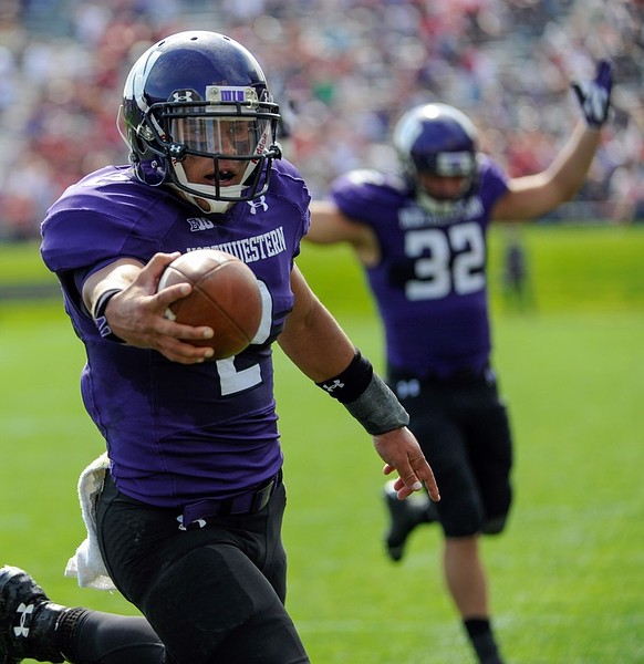 Sept 29, 2012; Evanston, IL, USA; Northwestern Wildcats quarterback Kain Colter celebrates after scoring a touchdown during game against Indiana Hoosiers at Ryan Field. Mandatory Credit: Benny Sieu-US PRESSWIRE