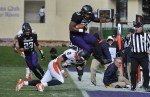 Nov 24, 2011; Evanston, IL, USA; Northwestern Wildcats linebacker David Nwabuisi (33) is forced out of bounds by Illinois Fighting Illini quarterback Nathan Scheelhaase (2) after intercepting a pass during the first half at Ryan Field. Mandatory Credit: David Banks-US PRESSWIRE