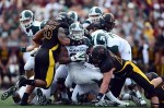 Sep 8, 2012; Mt. Pleasant, MI, USA; Michigan State Spartans running back Le'Veon Bell (24) is tackled by a group of Central Michigan Chippewas defenders in the second quarter at Kelly/Shorts Stadium. Mandatory Credit: Andrew Weber-US Presswire
