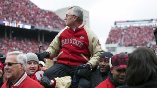 November 24, 2012; Columbus, OH, USA; Ohio State Buckeyes former coach Jim Tressel is held by players from his 2002 National Championship team in a game against the Michigan Wolverines at Ohio Stadium. Mandatory Credit: Greg Bartram-US PRESSWIRE
