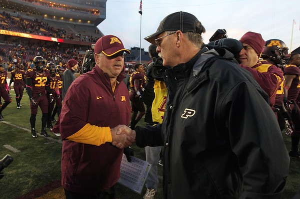 Oct 27, 2012; Minneapolis, MN, USA; Minnesota Golden Gophers head coach Jerry Kill and Purdue Boilermakers head coach Danny Hope shake hands following the game at TCF Bank Stadium. The Gophers defeated the Boilermakers 44-28. Mandatory Credit: Brace Hemmelgarn-US PRESSWIRE