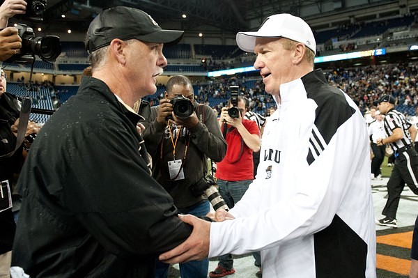 Dec 27, 2011; Detroit, MI, USA; Western Michigan Broncos head coach Bill Cubit (right) congratulates Purdue Boilermakers head coach Danny Hope (left) after the game at the 2011 Little Caesars Bowl at Ford Field. Purdue won 37-32. Mandatory Credit: Tim Fuller-US PRESSWIRE