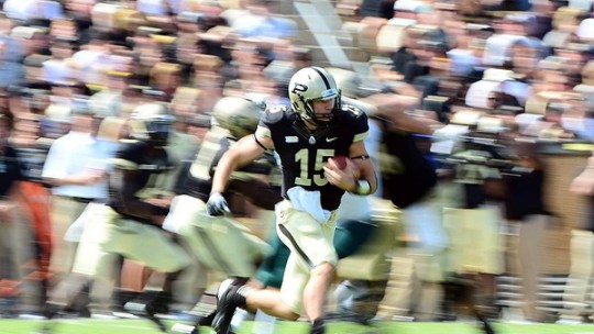 Sep 15, 2012; West Lafayette, IN, USA; Purdue Boilermakers quarterback Rob Henry (15) runs the ball in the fourth quarter against the Eastern Michigan Eagles at Ross Ade Stadium. Mandatory Credit: Andrew Weber-US Presswire