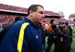 Nov 24, 2012; Columbus, OH, USA; Michigan Wolverines head coach Brady Hoke is escorted off the field after losing to Ohio State Buckeyes 26-21 at Ohio Stadium. Mandatory Credit: Andrew Weber-US PRESSWIRE