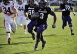 Nov 24, 2011; Evanston, IL, USA; Northwestern Wildcats running back Tyris Jones (3) runs for a touchdown against the Illinois Fighting Illini during the second half at Ryan Field. the Northwestern Wildcats defeated the Illinois Fighting Illini 50-14. Mandatory Credit: David Banks-US PRESSWIRE