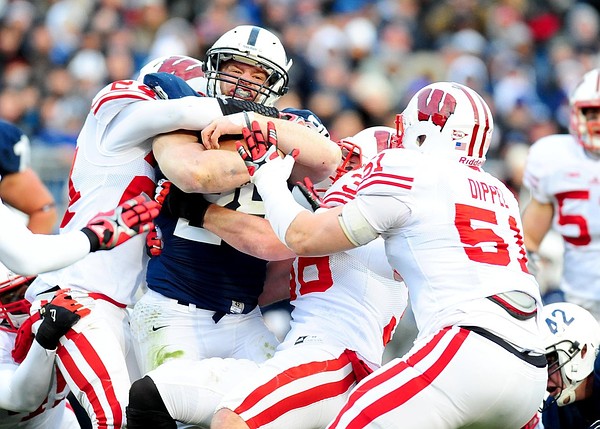 November 24, 2012; University Park, PA, USA; Penn State Nittany Lions running back Zach Zwinak (28) is wrapped up by several Wisconsin Badgers defenders at Beaver Stadium. Mandatory Credit: Evan Habeeb-US PRESSWIRE