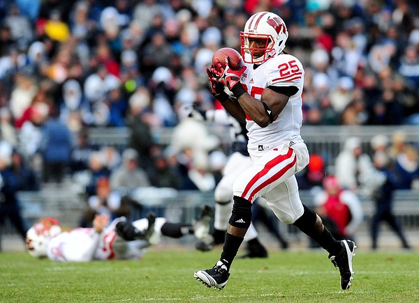 November 24, 2012; University Park, PA, USA;Wisconsin Badgers running back Melvin Gordon (25) catches a pass on the way to a 57 yard touchdown in the first quarter against the Penn State Nittany Lions at Beaver Stadium. Mandatory Credit: Evan Habeeb-US PRESSWIRE