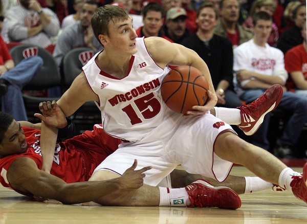 Nov 18, 2012; Madison, WI, USA; Wisconsin Badgers forward Sam Dekker (15) looks to pass after taking the ball away from Cornell Big Red guard Johnathan Gray during the first half at the Kohl Center. Mandatory Credit: Mary Langenfeld-US PRESSWIRE