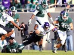 November 17, 2012; East Lansing, MI, USA; Northwestern Wildcats tight end Dan Vitale (40) is tackled by Michigan State Spartans safety Isaiah Lewis (9) during 1st quarter of a game at Spartan Stadium. Mandatory Credit: Mike Carter-US PRESSWIRE