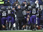 Nov 24, 2011; Evanston, IL, USA; Northwestern Wildcats head coach Pat Fitzgerald coaches against the Illinois Fighting Illini during the first half at Ryan Field. Mandatory Credit: David Banks-US PRESSWIRE