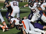 Nov 24, 2011; Evanston, IL, USA; Northwestern Wildcats defensive lineman Max Chapman (89) tackles Illinois Fighting Illini running back Dami Ayoola (22) for a safety during the second half at Ryan Field. the Northwestern Wildcats defeated the Illinois Fighting Illini 50-14. Mandatory Credit: David Banks-US PRESSWIRE
