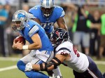 November 22, 2012; Detroit, MI, USA; Detroit Lions quarterback Matthew Stafford (9) is sacked by Houston Texans defensive end J.J. Watt (99) during the first quarter of a game on Thanksgiving at Ford Field. Mandatory Credit: Mike Carter-US PRESSWIRE