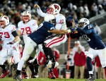 November 24, 2012; University Park, PA, USA; Wisconsin Badgers quarterback Curt Phillips (10) is hit by Penn State Nittany Lions defensive tackle Jordan Hill (47) at Beaver Stadium. Mandatory Credit: Evan Habeeb-US PRESSWIRE