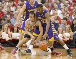 November 11, 2012; Columbus, OH, USA; Ohio State Buckeyes guard Aaron Craft (4) tries to steal the ball from Albany Great Danes guard Mike Black (10) at Value City Arena. Mandatory Credit: Greg Bartram-US PRESSWIRE