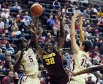Nov 27, 2012; Tallahassee, FL, USA; Minnesota Golden Gophers forward Trevor Mbakwe (32) loses the ball as he is defended by Florida State Seminoles guard Montay Brandon (5) and center Boris Bojanovsky (14) during the game at the Donald L. Tucker Center. Mandatory Credit: Melina Vastola-US PRESSWIRE