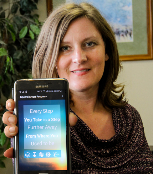 Brandi Spaulding shows off the Squirrel Smart Recovery app she worked on with OSU students.