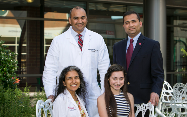 Blumstein (front, right) with members of the medical team that saved her life.