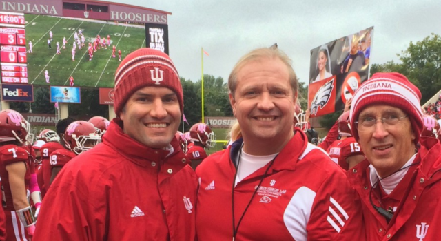 Port (center) with colleagues at an IU home game