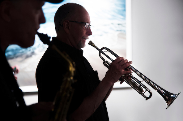 Marion T. ?Mo? Trout, Purdue's director of jazz bands, warms up before the ?Soundsuit Invasion? performance. Trout was the 2015 recipient of the Indianapolis Jazz Foundation Educator of the Year Award. (Photo courtesy of Purdue University and Mark Simons.)
