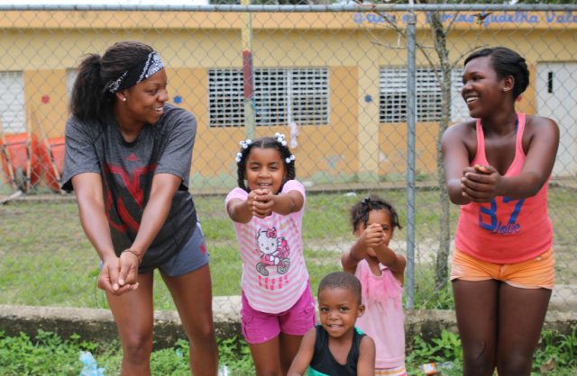 Holman (far left) shows kids from Las Pajas her moves. Photo courtesy of Nebraska Athletics.