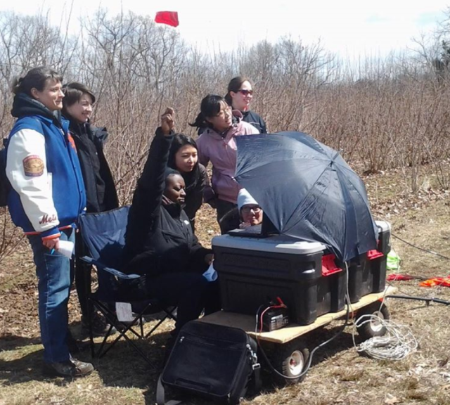 Jones (seated, center) does fieldwork with her fellow Rutgers geology students