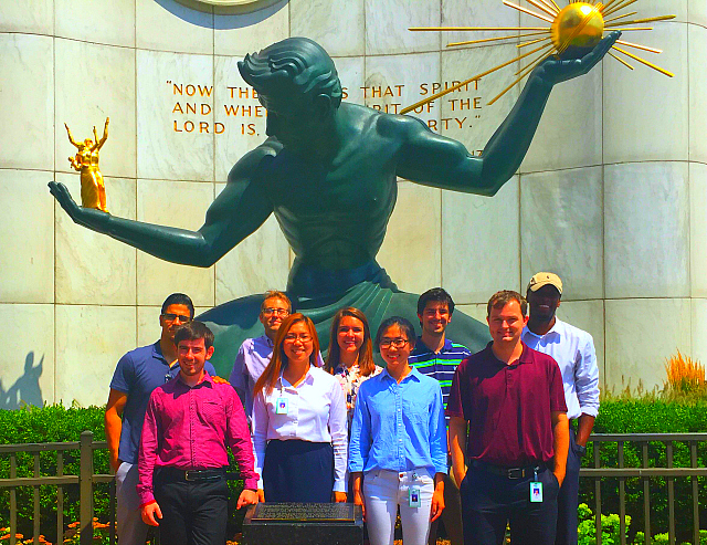 Michigan State University students in front of a statue in Detroit