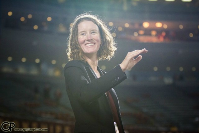 University of Minnesota marching band director Betsy McCann conducting