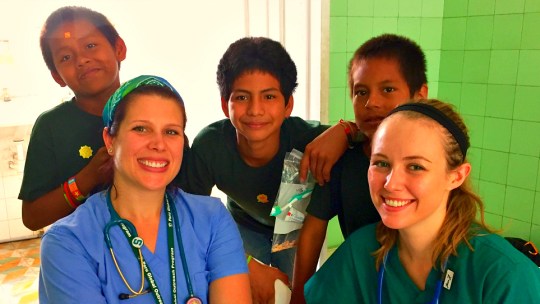 Students from Michigan State University's College of Osteopathic Medicine with young patients in Peru.
