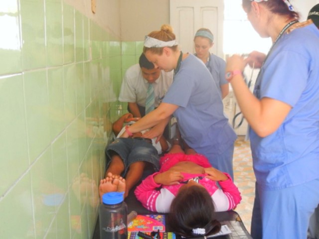 Doctors and students from Michigan State University's College of Osteopathic Medicine treating patients in Peru.