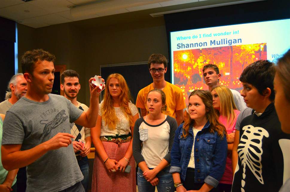 Nate Staniforth performs magic for the students of the University of Iowa Green Room course.