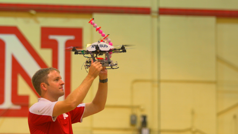 University of Nebraska student working on a fire-starting drone