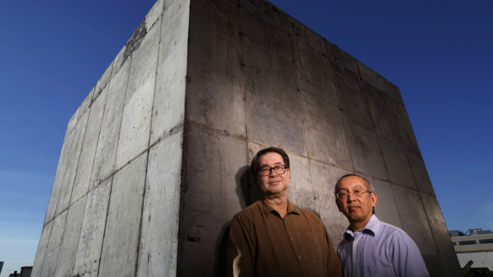University of Nebraska-Lincoln professors Christopher Tuan and Lim Nguyen stand beside their taconite-infused concrete