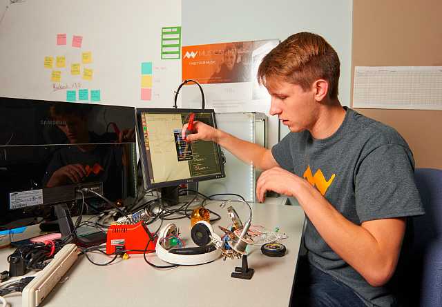 Penn State student Alex Patin working on his Trills headphones for Musical Minds.