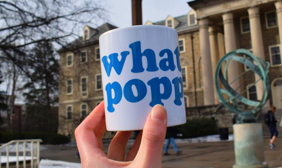 A branded mug from Penn State student's event listing startup What'sPoppin