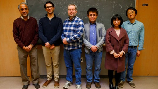 A team of Indiana University researchers and chemists who worked on a molecule that can turn carbon dioxide into carbon monoxide using light and electricity.
