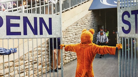 Penn State's mascot opens a gate at Beaver Stadium before a football game