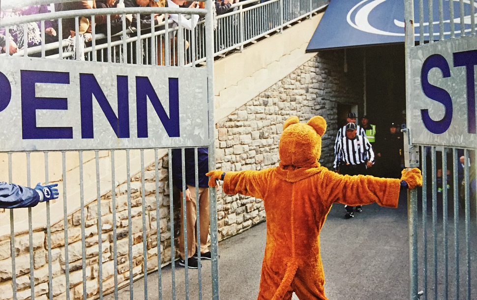 Penn State's mascot opens a gate at Beaver Stadium before a football game