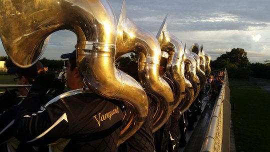 Sousaphone players in a marching band