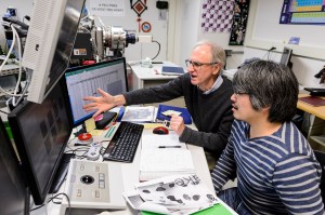 Geoscience Professor John Valley, left, and research scientist Kouki Kitajima collaborate in the Wisconsin Secondary Ion Mass Spectrometer Lab (WiscSIMS) in Weeks Hall at the University of Wisconsin-Madison on Dec. 15, 2017. Researchers J. William Schopf, professor of paleobiology at UCLA, and John W. Valley, professor of geoscience at UW-Madison, have confirmed that microscopic fossils discovered in a nearly 3.5 billion-year-old piece of rock in Western Australia are the oldest fossils ever found and indeed the earliest direct evidence of life on Earth. (Photo by Jeff Miller / UW-Madison)